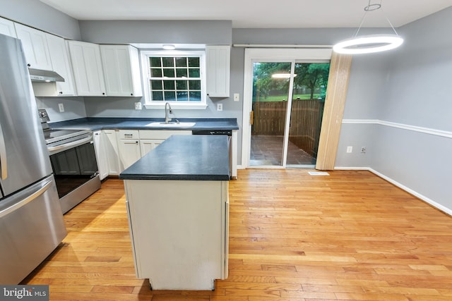4 Habersham Ct, Silver Spring, MD 20906 - kitchen featuring appliances with stainless steel finishes, dark countertops, white cabinets, ventilation hood, and light wood-style flooring