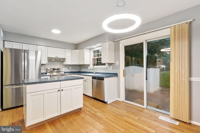4 Habersham Ct, Silver Spring, MD 20906 - kitchen with stainless steel appliances, under cabinet range hood, dark countertops, white cabinets, and light wood finished floors