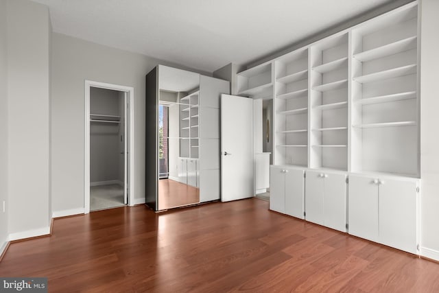 955 26th St NW Unit 510, Washington, DC 20037 - unfurnished bedroom with wood finished floors