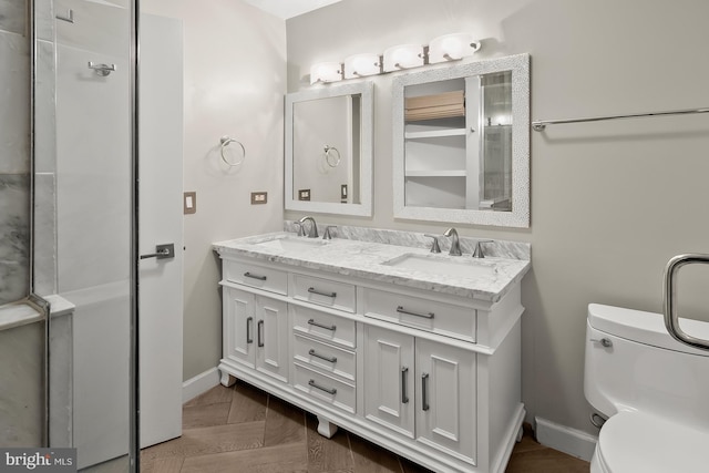 955 26th St NW Unit 510, Washington, DC 20037 - bathroom with double vanity and baseboards