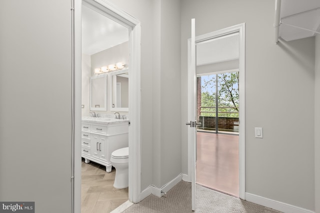 955 26th St NW Unit 510, Washington, DC 20037 - bathroom with vanity and baseboards
