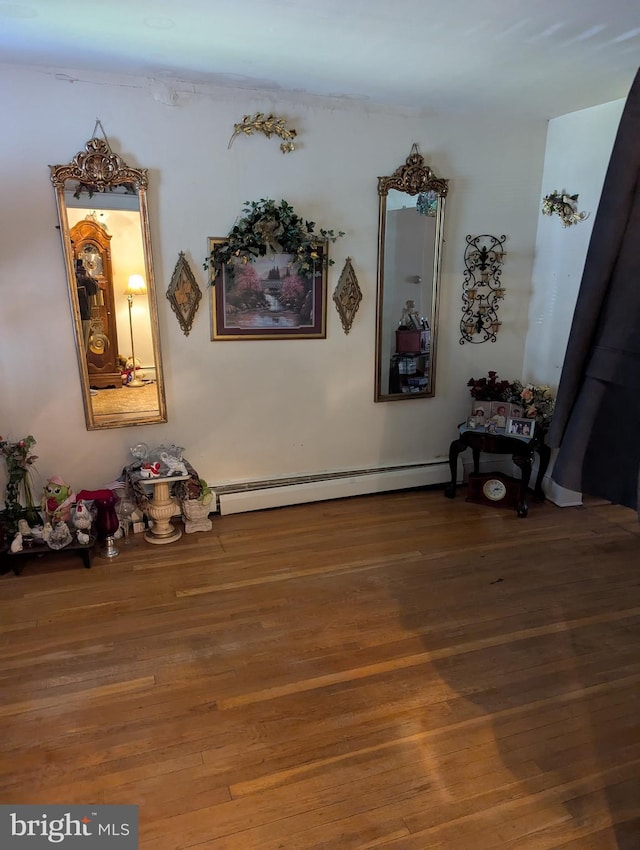 2812 6th NE, Washington, DC 20017 - interior space featuring a baseboard radiator and wood finished floors