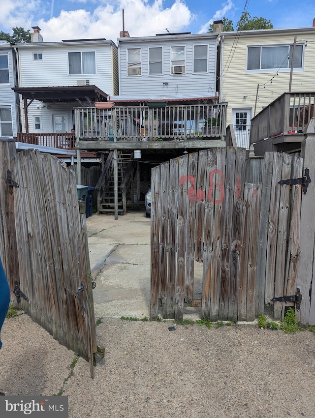 2812 6th NE, Washington, DC 20017 - rear view of property with a deck, stairs, and a carport