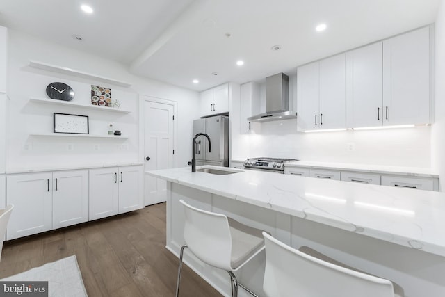 3317 16th St NW Unit 2, Washington, DC 20010 - kitchen featuring wall chimney range hood, open shelves, white cabinets, dark wood finished floors, and light stone countertops
