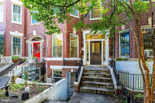 3317 16th St NW Unit 2, Washington, DC 20010 - view of exterior entry featuring brick siding and cooling unit