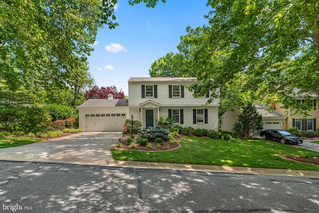 6162 Commadore Ct, Columbia, MD 21045 - colonial house with driveway, a front yard, an attached garage, and a chimney