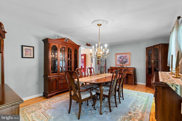 6162 Commadore Ct, Columbia, MD 21045 - dining space featuring a chandelier and light wood-style flooring