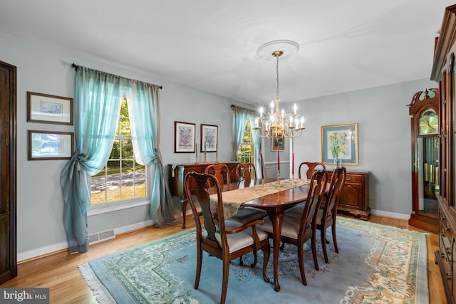 6162 Commadore Ct, Columbia, MD 21045 - dining room featuring a chandelier and light wood-style flooring
