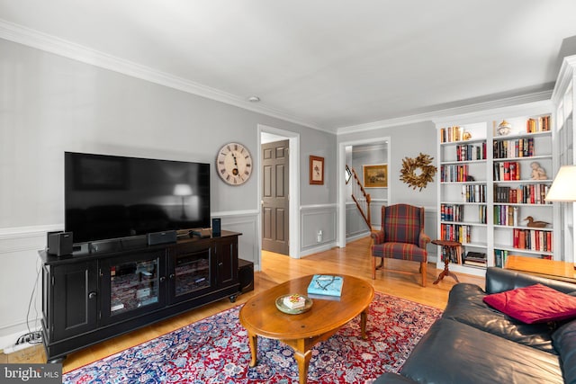 6162 Commadore Ct, Columbia, MD 21045 - living room featuring ornamental molding, light wood-style flooring, a wainscoted wall, and stairs