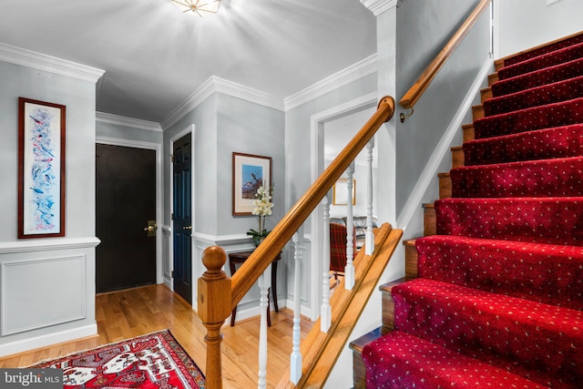 6162 Commadore Ct, Columbia, MD 21045 - stairs featuring wood finished floors, crown molding, and a wainscoted wall