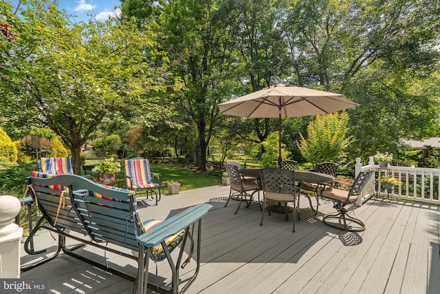 6162 Commadore Ct, Columbia, MD 21045 - wooden deck with outdoor dining space and view of wooded area