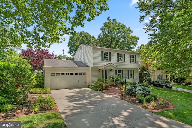 6162 Commadore Ct, Columbia, MD 21045 - colonial inspired home with a garage, concrete driveway, a chimney, and a front yard