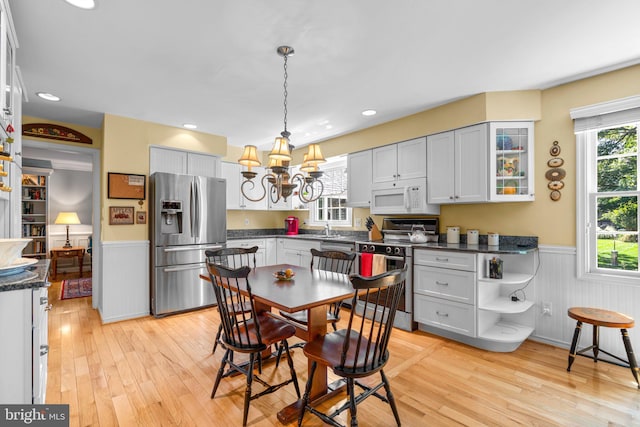 6162 Commadore Ct, Columbia, MD 21045 - kitchen featuring stainless steel appliances, a wainscoted wall, light wood-type flooring, healthy amount of natural light, and recessed lighting