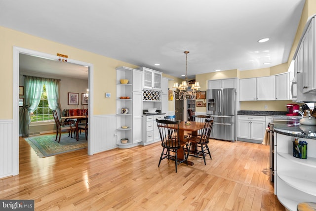 6162 Commadore Ct, Columbia, MD 21045 - kitchen with stainless steel fridge with ice dispenser, open shelves, electric stove, dark countertops, and wainscoting