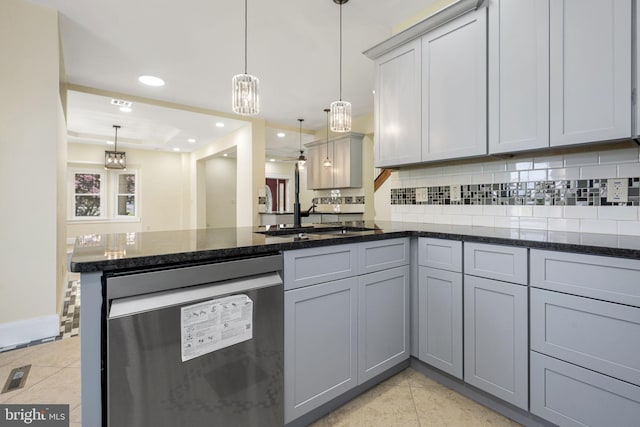1432 Frush Valley Rd, Reading, PA 19605 - kitchen featuring stainless steel dishwasher, a peninsula, light tile patterned floors, decorative backsplash, and pendant lighting