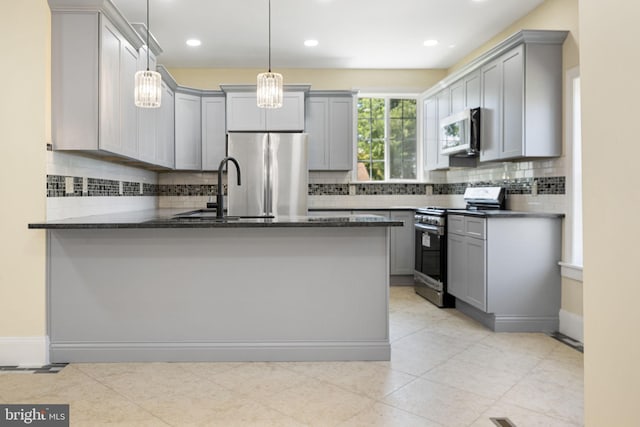 1432 Frush Valley Rd, Reading, PA 19605 - kitchen featuring appliances with stainless steel finishes, gray cabinets, a peninsula, backsplash, and recessed lighting