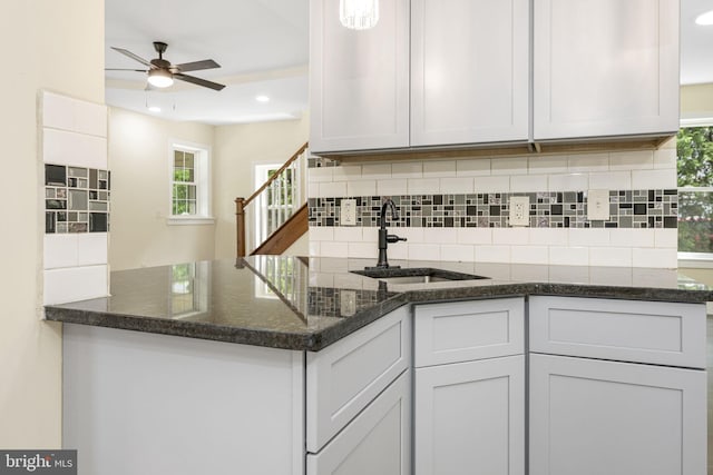 1432 Frush Valley Rd, Reading, PA 19605 - kitchen featuring a peninsula, backsplash, ceiling fan, recessed lighting, and dark stone counters
