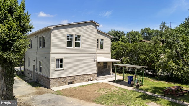 1432 Frush Valley Rd, Reading, PA 19605 - back of property with stone siding and a yard
