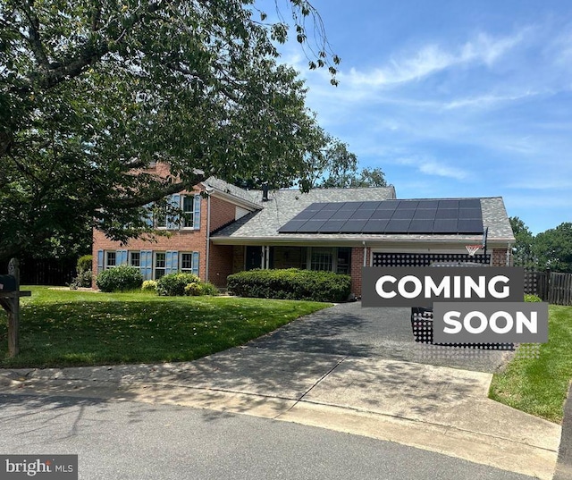 6 Thorburn Ct, Gaithersburg, MD 20878 - view of front of property featuring roof mounted solar panels, brick siding, driveway, and roof with shingles