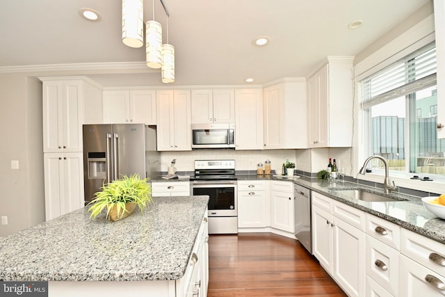 1103 Morse St NE, Washington, DC 20002 - kitchen featuring appliances with stainless steel finishes, white cabinetry, decorative backsplash, light stone counters, and recessed lighting