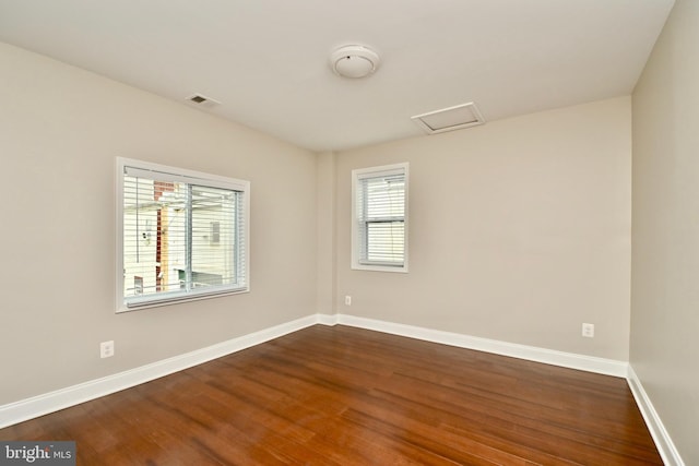 1103 Morse St NE, Washington, DC 20002 - unfurnished room with dark wood finished floors and attic access