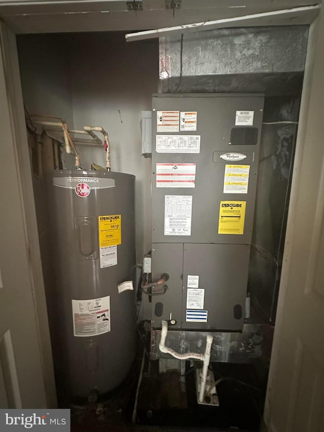 3709 Chesholm Rd, Baltimore, MD 21216 - utility room featuring electric water heater and heating unit