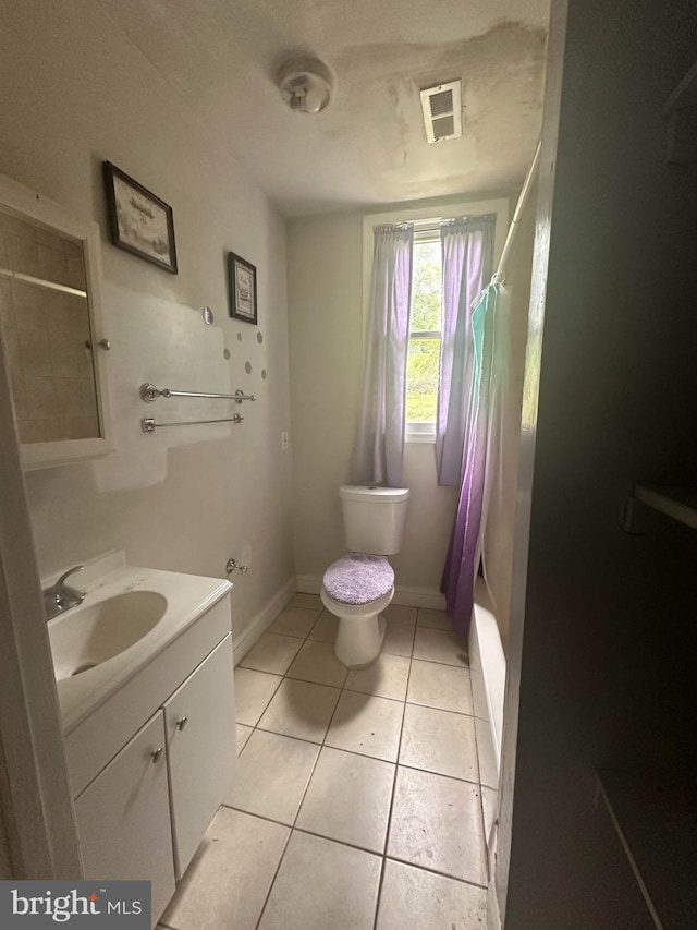 3709 Chesholm Rd, Baltimore, MD 21216 - full bath featuring vanity, tile patterned floors, and shower / tub combo