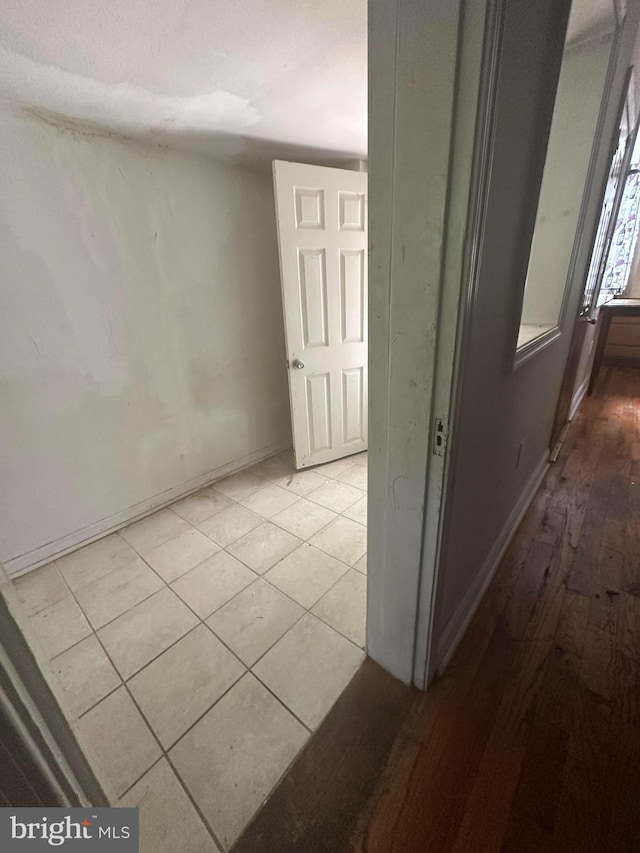 3709 Chesholm Rd, Baltimore, MD 21216 - corridor featuring baseboards and light wood-style flooring