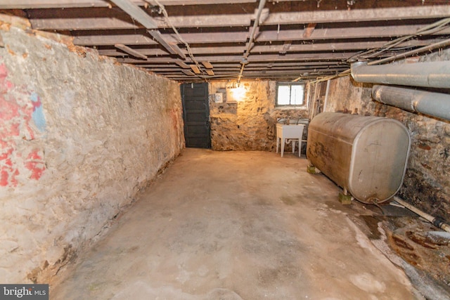 2415 Baker St, Baltimore, MD 21216 - basement featuring heating fuel and a sink