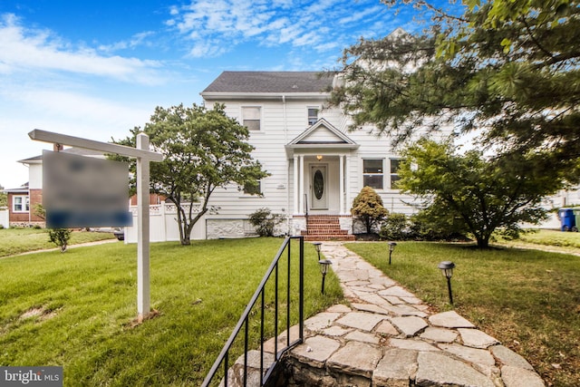 4404 Carleview Rd, Baltimore, MD 21207 - view of front of home featuring a front yard and roof with shingles
