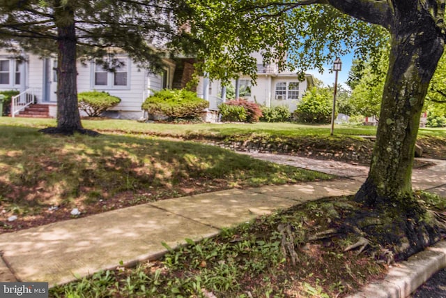 4404 Carleview Rd, Baltimore, MD 21207 - view of property hidden behind natural elements with a front yard and entry steps