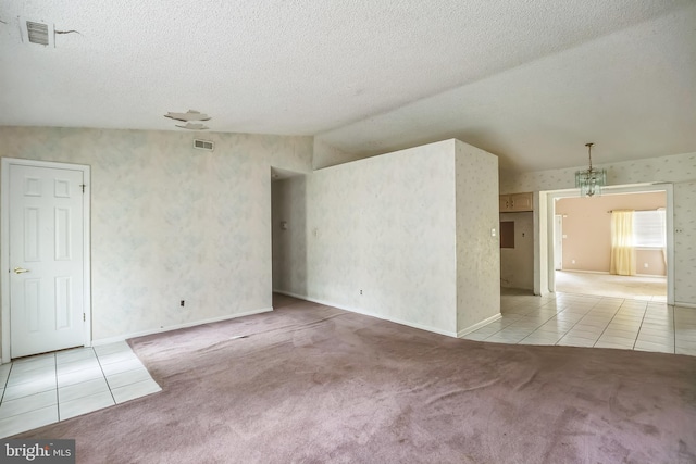 20 Sugar Bush Dr, Sicklerville, NJ 08081 - tiled spare room featuring a textured ceiling, carpet, and vaulted ceiling