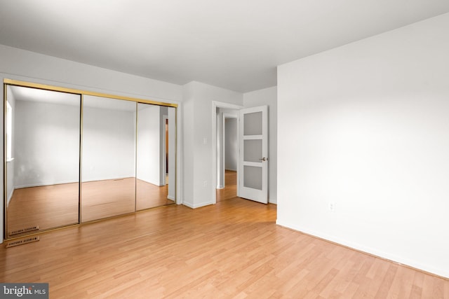 52 Anna Ct Unit 275, Gaithersburg, MD 20877 - unfurnished bedroom with wood finished floors and a closet