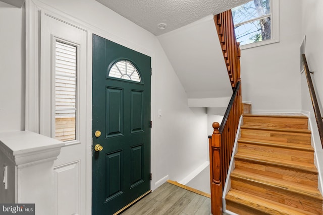 52 Anna Ct Unit 275, Gaithersburg, MD 20877 - foyer entrance with light wood-type flooring, stairway, and a textured ceiling