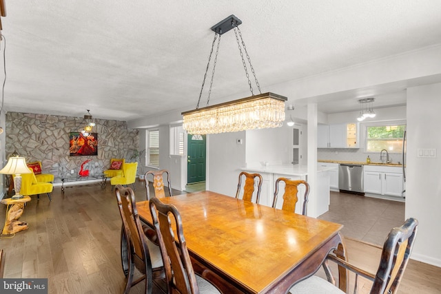 52 Anna Ct Unit 275, Gaithersburg, MD 20877 - dining area featuring a textured ceiling, wood finished floors, and a chandelier