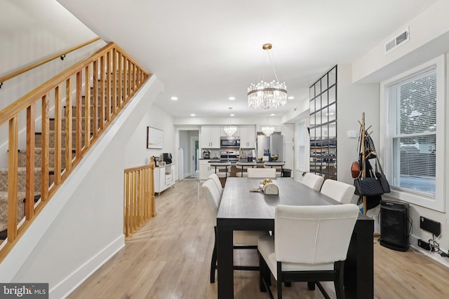 531 Redfern St, Hamilton, NJ 08610 - dining space featuring a chandelier, stairway, light wood finished floors, and recessed lighting