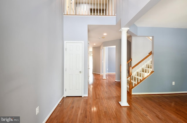 1007 Wright Ct, Fredericksburg, VA 22401 - foyer featuring decorative columns, wood-type flooring, and stairs