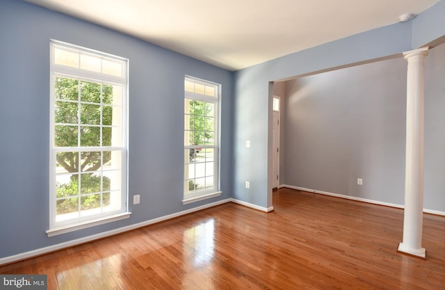1007 Wright Ct, Fredericksburg, VA 22401 - spare room featuring ornate columns, wood-type flooring, and a smoke detector