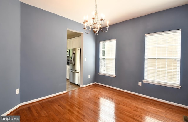 1007 Wright Ct, Fredericksburg, VA 22401 - spare room featuring a chandelier and wood finished floors