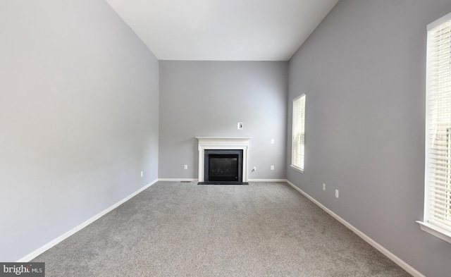 1007 Wright Ct, Fredericksburg, VA 22401 - unfurnished living room featuring a fireplace with flush hearth and carpet