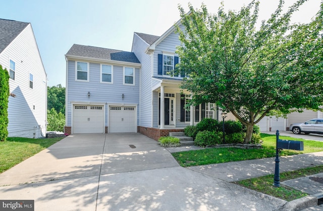 1007 Wright Ct, Fredericksburg, VA 22401 - view of front of property with covered porch, a garage, and driveway