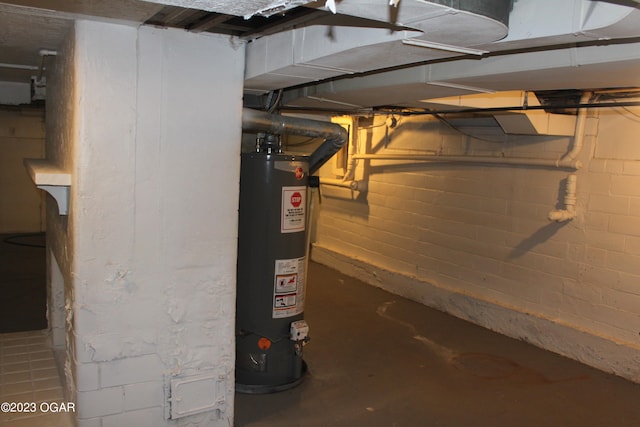 utility room featuring gas water heater