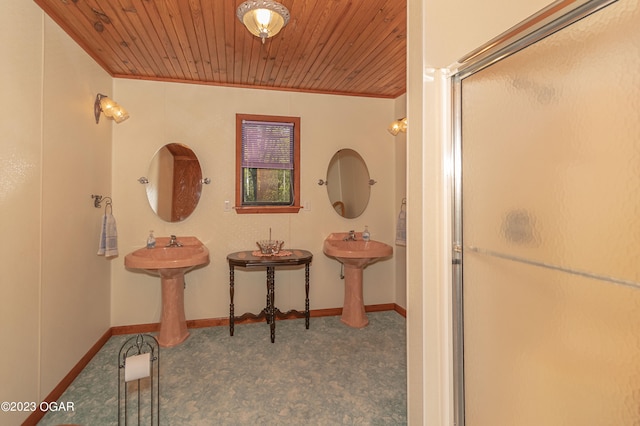 corridor featuring wooden ceiling, ornamental molding, and carpet