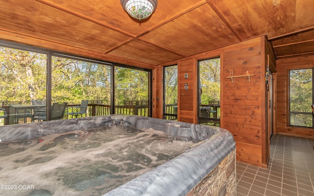 sunroom / solarium with wood ceiling and lofted ceiling