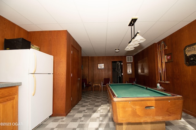 game room with wooden walls, pool table, and light tile floors