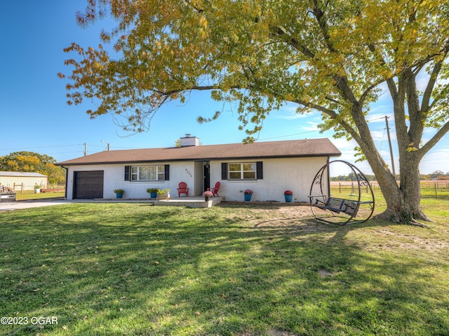 ranch-style house with a front lawn and a garage