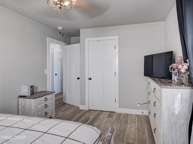 unfurnished bedroom featuring light hardwood / wood-style floors and ceiling fan