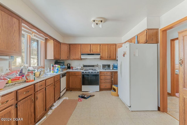 kitchen with light tile floors and white appliances