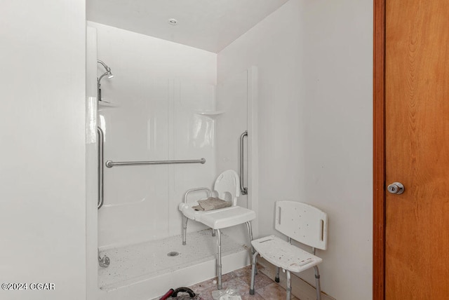 bathroom featuring tile flooring and a shower