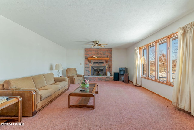 living room with light colored carpet, a fireplace, brick wall, ceiling fan, and a textured ceiling